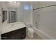 Bright bathroom featuring a white vanity, toilet, and bathtub/shower combination at 12164 S 184Th Ave, Goodyear, AZ 85338