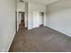 Neutral bedroom with carpet floors, a closet, and natural light at 12164 S 184Th Ave, Goodyear, AZ 85338