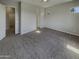 Bedroom featuring neutral walls, carpet, and windows that provide natural light at 12164 S 184Th Ave, Goodyear, AZ 85338