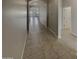 Hallway with tile floors leading to the living spaces at 12164 S 184Th Ave, Goodyear, AZ 85338