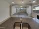 Open-concept kitchen featuring granite countertops and stainless steel double sink at 12164 S 184Th Ave, Goodyear, AZ 85338