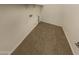 Compact laundry room featuring tile flooring, white walls, and shelving for storage at 12164 S 184Th Ave, Goodyear, AZ 85338