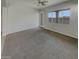 Spacious living room featuring neutral paint, carpeted floors, and an open concept layout at 12164 S 184Th Ave, Goodyear, AZ 85338