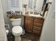 A well-maintained bathroom with a vanity, toilet, and organized countertop at 124 S 54Th St # 42, Mesa, AZ 85206