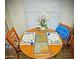 A charming dining area displaying a round table set for two, by a bright window at 124 S 54Th St # 42, Mesa, AZ 85206