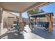 Covered patio space with an outdoor dining and lounge area and a gazebo with seating at 14532 N 146Th Ln, Surprise, AZ 85379