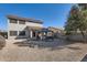 Gravel backyard features a covered patio, gazebo with seating, and a privacy wall at 14532 N 146Th Ln, Surprise, AZ 85379