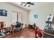 Comfortable bedroom with hardwood floors, natural light, and a cozy workspace at 14532 N 146Th Ln, Surprise, AZ 85379