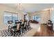 Elegant dining room featuring a chandelier, formal dining set, and wood and carpet flooring at 14532 N 146Th Ln, Surprise, AZ 85379