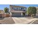 Charming two-story home with well-maintained landscaping, covered entry, and a two-car garage at 14532 N 146Th Ln, Surprise, AZ 85379