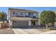 Charming two-story home with a well-maintained front yard and a two car garage, perfect for a growing Gathering at 14532 N 146Th Ln, Surprise, AZ 85379