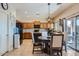 Inviting kitchen with oak cabinetry, black appliances, a charming eat-in area and sliding glass doors at 14532 N 146Th Ln, Surprise, AZ 85379