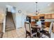 Open kitchen with stainless steel appliances, a central island, and eat-in dining area at 14532 N 146Th Ln, Surprise, AZ 85379