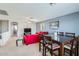 Spacious living and dining area with neutral tones, creating a comfortable and inviting atmosphere at 14532 N 146Th Ln, Surprise, AZ 85379