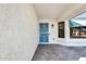 Charming front porch with unique door detail and a covered entryway at 17014 N 127Th Dr, Sun City West, AZ 85375