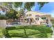 Expansive backyard with a fenced pool, outdoor bar, pergola, and artificial turf at 1901 W Mulberry Dr, Chandler, AZ 85286