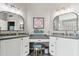 Vanity with dual sinks, framed mirrors, and vanity lighting at 1901 W Mulberry Dr, Chandler, AZ 85286