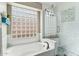 Bathroom with a shower, glass block window and soaking tub at 1901 W Mulberry Dr, Chandler, AZ 85286