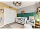 Well decorated Bedroom with plush chair, trendy decor, and spacious closet in warm colors at 1901 W Mulberry Dr, Chandler, AZ 85286