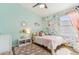 Light-filled bedroom with floral wallpaper, unique mirror, and colorful decor at 1901 W Mulberry Dr, Chandler, AZ 85286