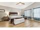 Spacious main bedroom with vaulted ceilings, wood flooring, and soft, natural lighting at 1901 W Mulberry Dr, Chandler, AZ 85286
