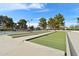 Well-maintained bocce ball courts with surrounding trees and seating areas at 1901 W Mulberry Dr, Chandler, AZ 85286