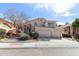 Two-story home featuring a three-car garage, desert landscaping, and a tile roof at 1901 W Mulberry Dr, Chandler, AZ 85286