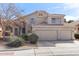Charming two-story home featuring a three-car garage, desert landscaping, and a tile roof at 1901 W Mulberry Dr, Chandler, AZ 85286