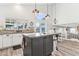 Bright kitchen featuring an island with granite countertops and modern appliances at 1901 W Mulberry Dr, Chandler, AZ 85286