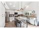 Well-lit kitchen featuring an island with granite countertops and stainless steel appliances at 1901 W Mulberry Dr, Chandler, AZ 85286