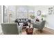Bright and airy living room with large arched windows and comfortable seating at 1901 W Mulberry Dr, Chandler, AZ 85286