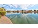 A view of a serene community pond reflecting the blue sky and clouds on a sunny day at 1901 W Mulberry Dr, Chandler, AZ 85286