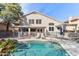 Gorgeous backyard pool area features lounge chairs, umbrellas, and a tranquil atmosphere at 1901 W Mulberry Dr, Chandler, AZ 85286