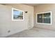Enclosed back porch with secure door and security lighting at 20218 N 33Rd Pl, Phoenix, AZ 85050