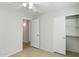Bedroom with an open closet with shelving and view into an adjacent room at 20218 N 33Rd Pl, Phoenix, AZ 85050