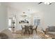Well-lit dining area with a chandelier adjacent to the kitchen provides a comfortable setting for meals at 20218 N 33Rd Pl, Phoenix, AZ 85050
