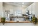 Bright kitchen with stainless appliances, granite countertops, and a breakfast bar at 20218 N 33Rd Pl, Phoenix, AZ 85050