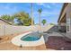 Sparkling pool surrounded by rocks and green vegetation at 20218 N 33Rd Pl, Phoenix, AZ 85050