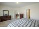 Comfortable main bedroom with natural light and neutral colored walls at 2196 N Potomac Ct, Florence, AZ 85132