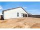Spacious backyard featuring a pristine white house and block wall at 25606 N 154Th Ln, Surprise, AZ 85387