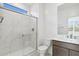 Bright bathroom features a marble countertop and shower with glass doors at 25606 N 154Th Ln, Surprise, AZ 85387