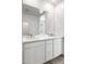 Contemporary bathroom features double sinks and a sleek white vanity at 25606 N 154Th Ln, Surprise, AZ 85387