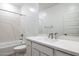 Modern bathroom features white cabinets, countertops, and tiled shower with tub at 25606 N 154Th Ln, Surprise, AZ 85387