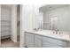 Modern bathroom featuring double sinks, white cabinets, and neutral wall color at 25606 N 154Th Ln, Surprise, AZ 85387