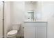 Contemporary bathroom features single sink, sleek white vanity, and tile shower at 25606 N 154Th Ln, Surprise, AZ 85387