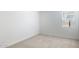 Bright bedroom with neutral carpet, white walls, and a window to let in light at 25606 N 154Th Ln, Surprise, AZ 85387