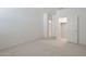 Spacious bedroom with doors to bathroom and closet, and plush carpet, creating a cozy and relaxing space at 25606 N 154Th Ln, Surprise, AZ 85387