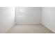 Bright bedroom with neutral carpet, white walls, and a window to let in light at 25606 N 154Th Ln, Surprise, AZ 85387