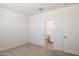 Bright bedroom showing entry to bathroom and closet at 25606 N 154Th Ln, Surprise, AZ 85387