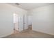 Spacious bedroom featuring a view into the bathroom and hallway at 25606 N 154Th Ln, Surprise, AZ 85387